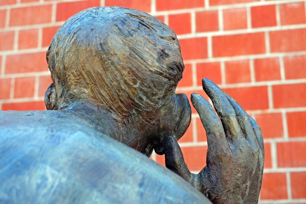 statue cupping its ear, symbolising that no one listens to me